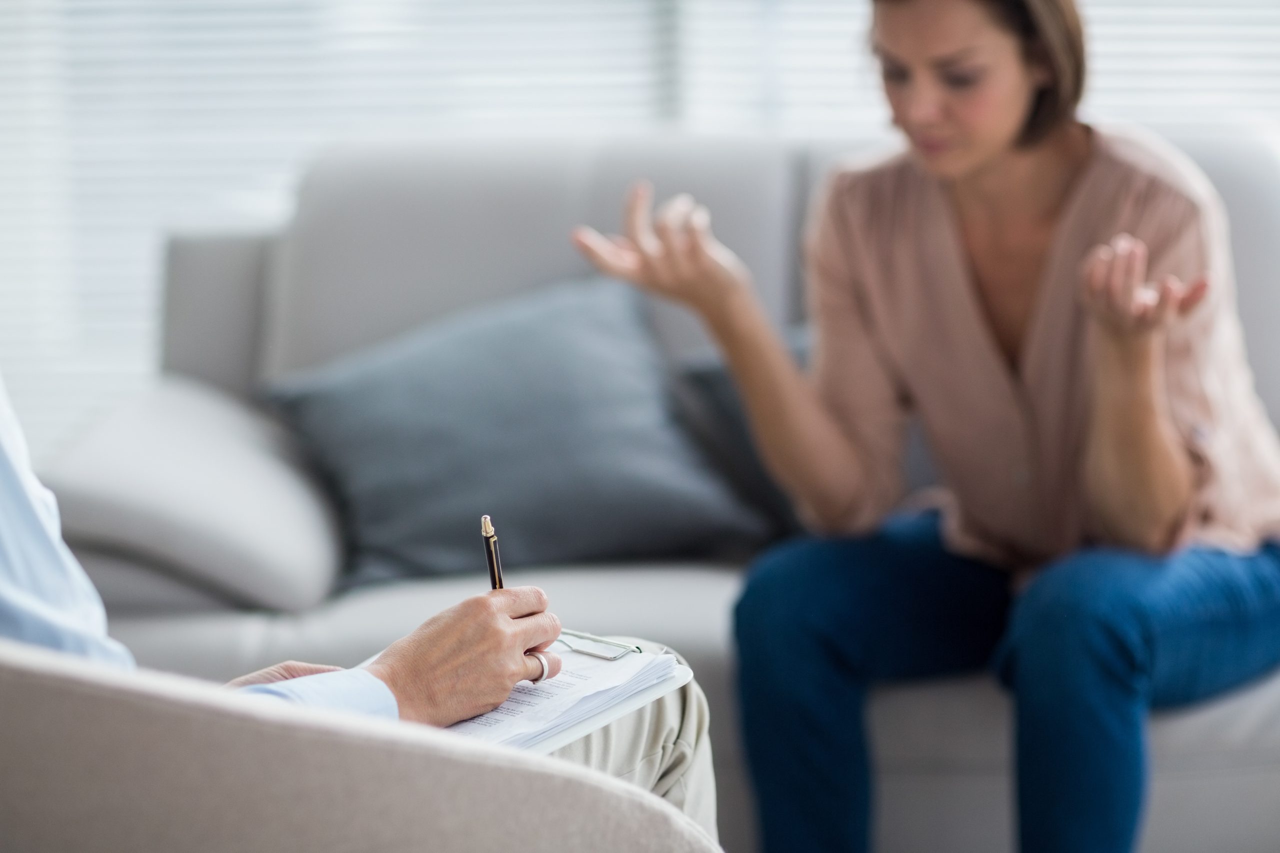 Therapist making notes of patient